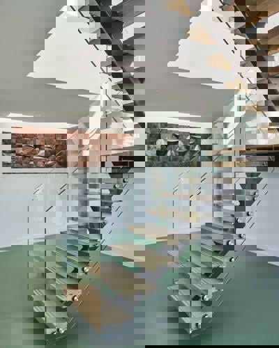 Modern staircase inside Cliff Self Sufficient Beach House