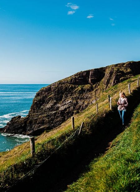 Guest walking the Cliff Walk in Ardmore