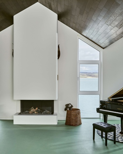 Sea-view living room with piano at Cliff Beach House