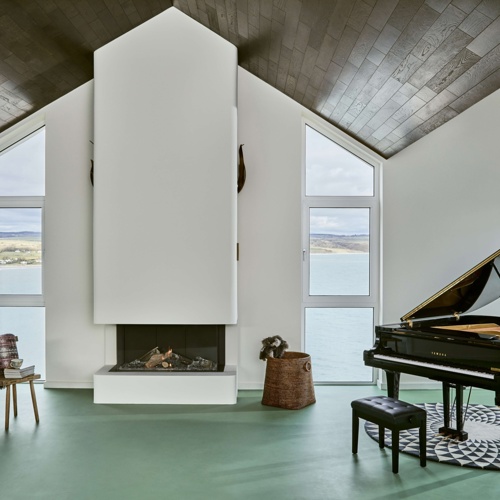 Sea-view living room with piano at Cliff Beach House