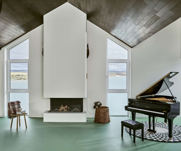 Sea-view living room with piano at Cliff Beach House