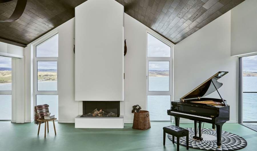 Sea-view living room with piano at Cliff Beach House
