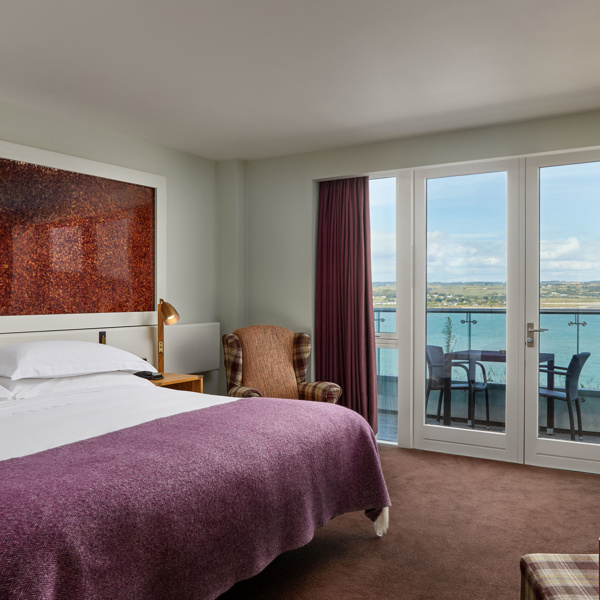 Glass balconies offer dramatic views of the atlantic blue at Cliff House Hotel