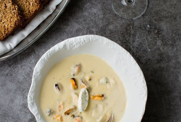 Pour into serving bowl and garnish with herbs at Cliff House Hotel