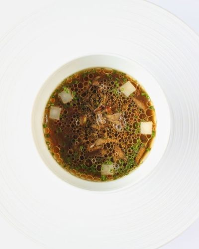 Fine dining soup course on House Restaurant Tasting Menu