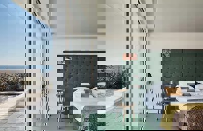 Sea-view bedroom at Cliff Beach House