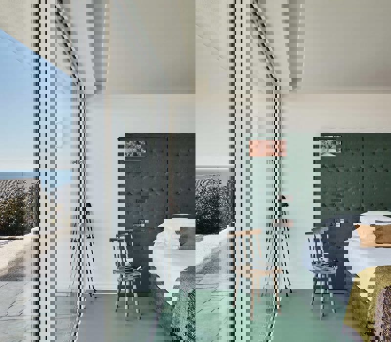 Sea-view bedroom at Cliff Beach House