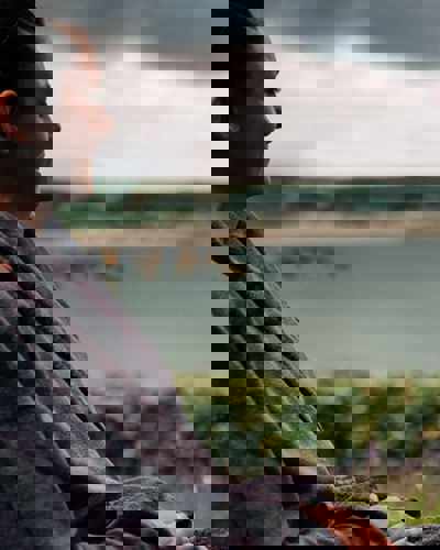 Guest in spa robe enjoying the sea view at The Well at Cliff