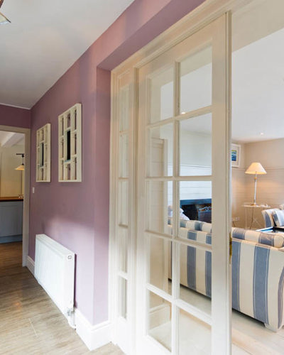 Hallway leading to a guest room at Cliff Cottage