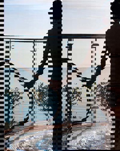 Outdoor hydrotherapy pool with sea view at The Well at Cliff