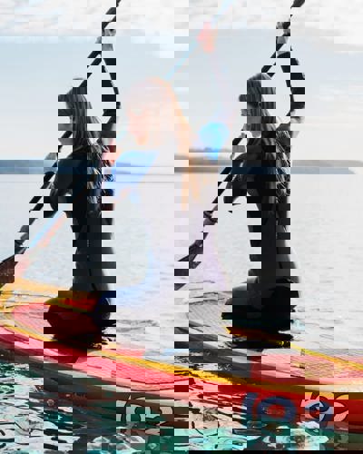 Woman paddleboarding in Ardmore Bay near Cliff House Hotel