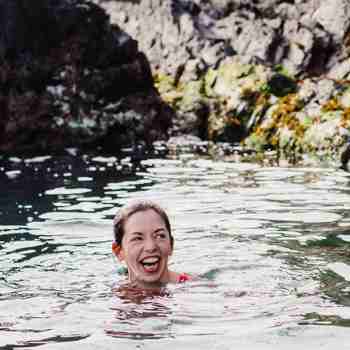 Guest swimming in the sea near Cliff House Hotel